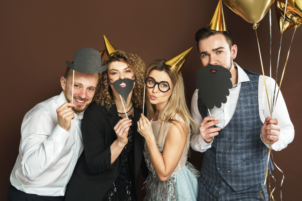 group-happy-people-wearing-party-hats-with-funny-photo-booth-props-are-celebrating-holiday-event